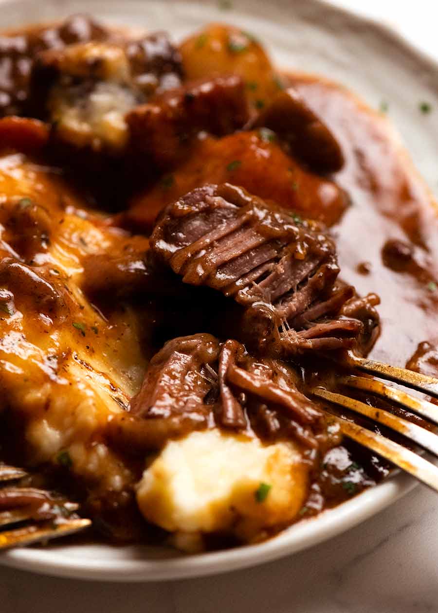 Close up showing fork tender Beef Bourguignon meat