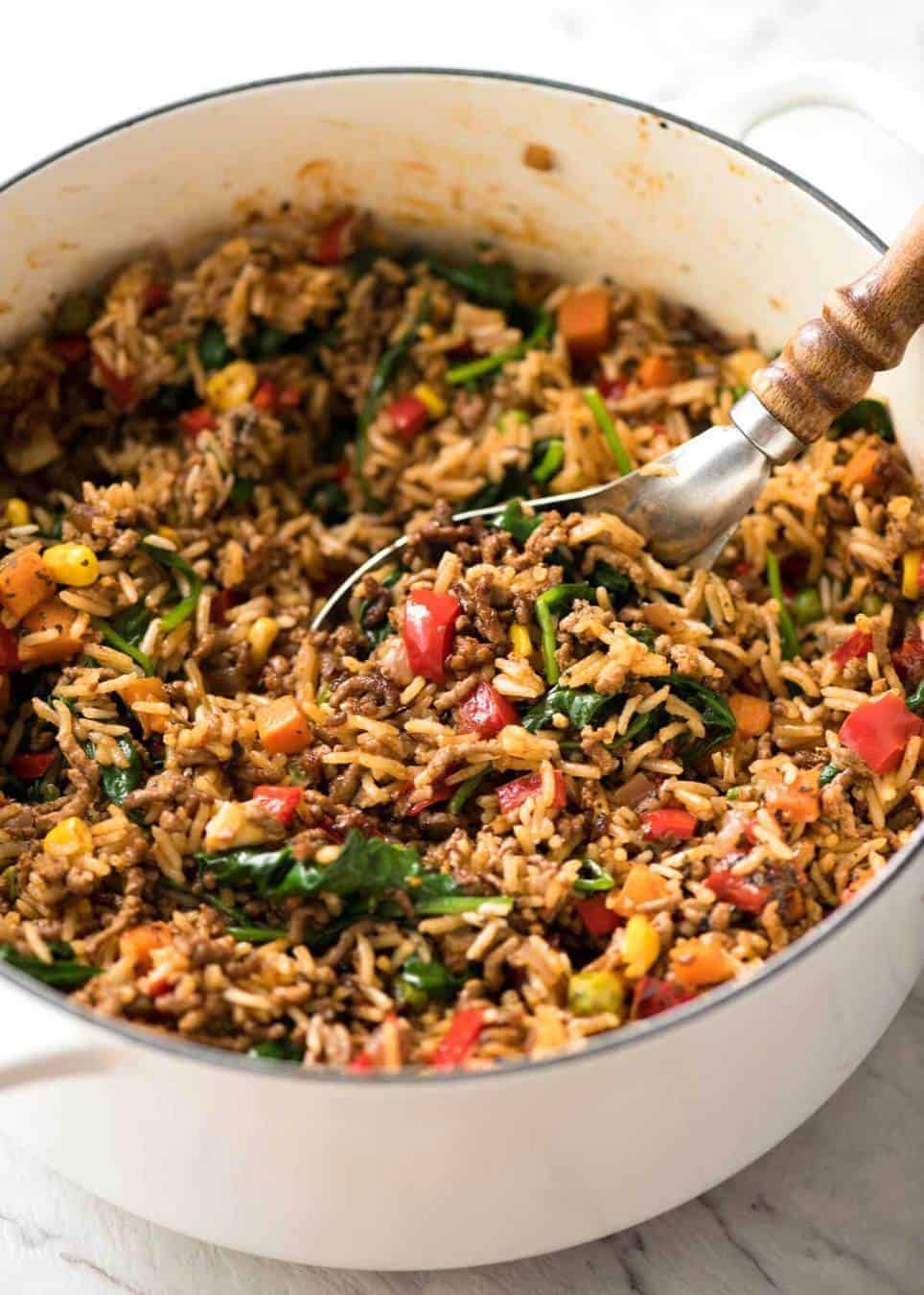 A quick, fabulous midweek meal - this ground Beef and Rice is made by browning ground beef, then cooking it with flavoured rice and loads of veggies. Irresistibly delicious! www.recipetineats.com
