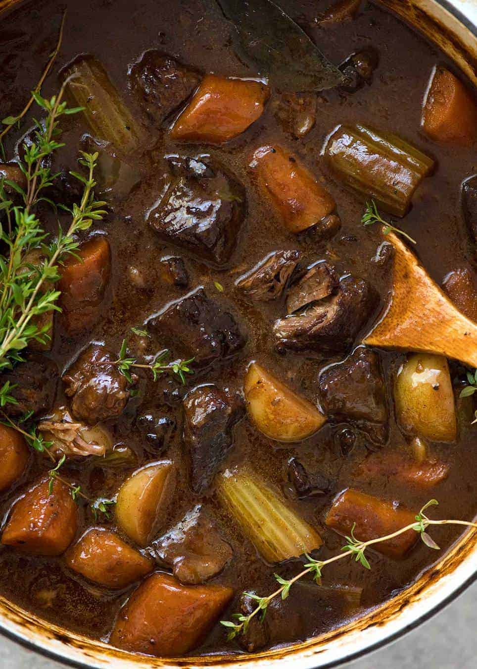 Overhead photo of Beef Stew with carrots and potatoes in a casserole pot.