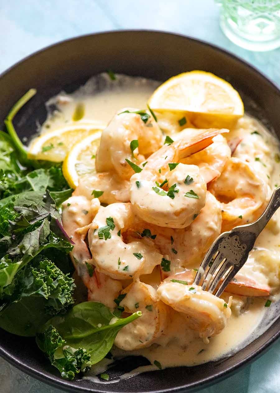 Creamy Garlic Prawns (Shrimp) on a plate served with a side of mashed potato