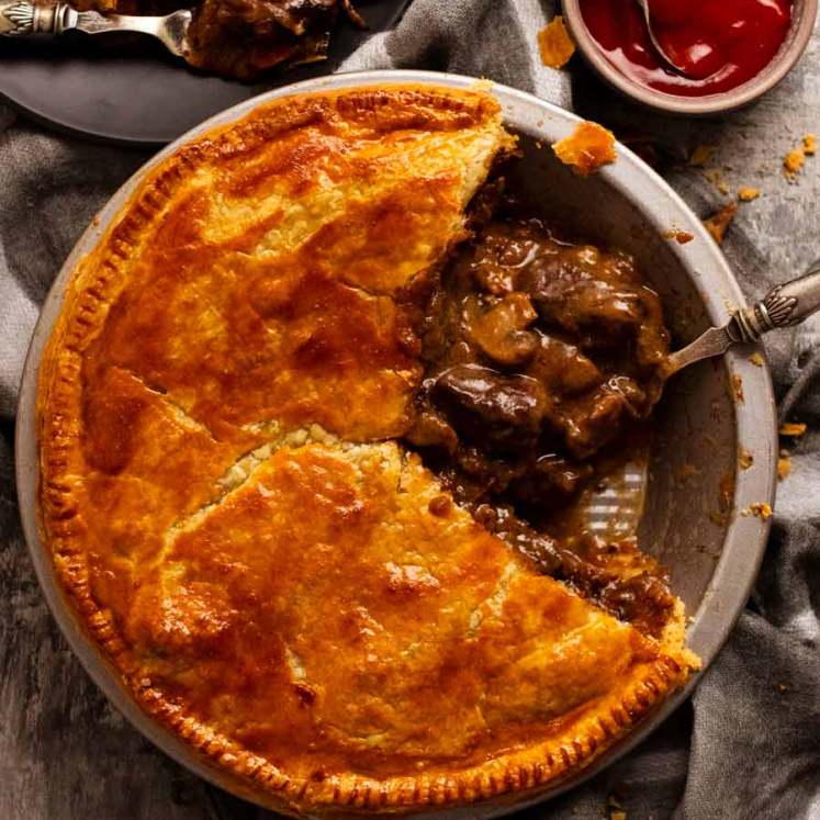 Family Meat Pie with slice taken out of it