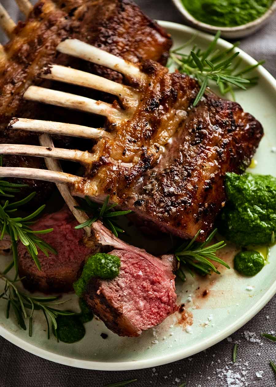 Rack of lamb on a plate with salsa verde