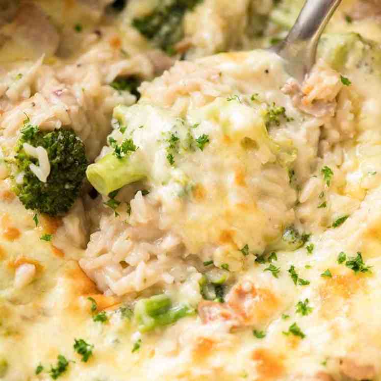 Close up of spoon scooping up One Pot Chicken Broccoli Rice Casserole