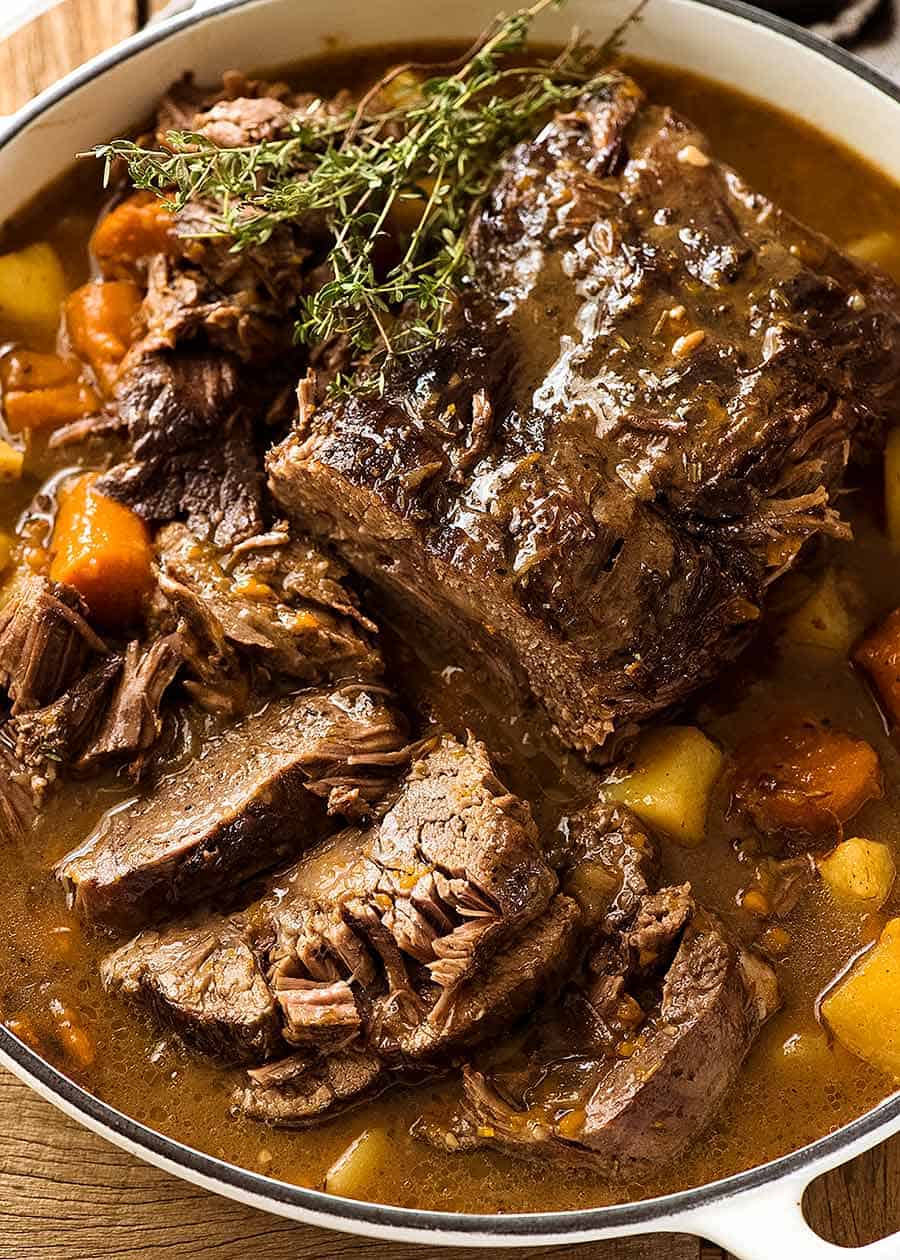 Slow Cooker Pot Roast in a casserole dish, ready to be served